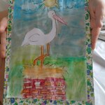 Portret bociana na kominie