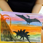 Czarne dinozaury na tle wieczornego nieba.jpg