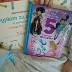 Dyplom i ksiązka jako nagrody za udział w Akcji
