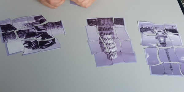 Uczeń układa puzzle z zabytkami architektury